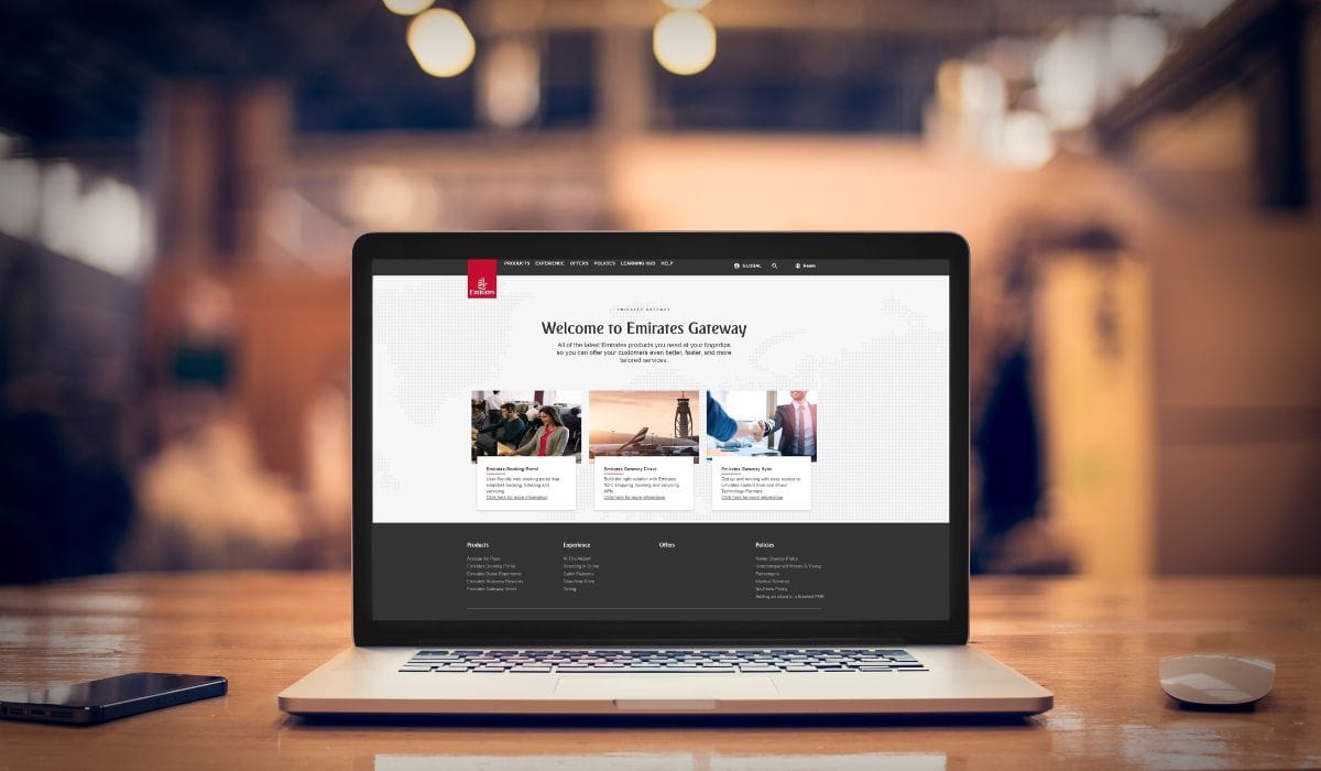 Open laptop showing the Emirates Gateway website on a desk, illustrating the airline’s NDC and digital retailing platform.
