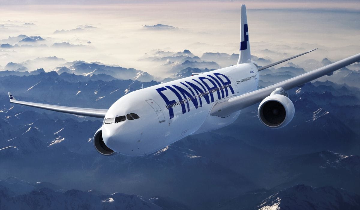 Finnair Airbus A330 aircraft in flight over mountainous terrain