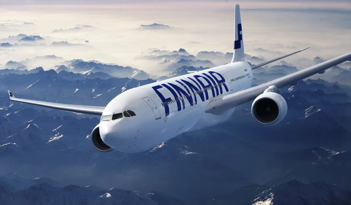 Finnair Airbus A330 aircraft in flight over mountainous terrain
