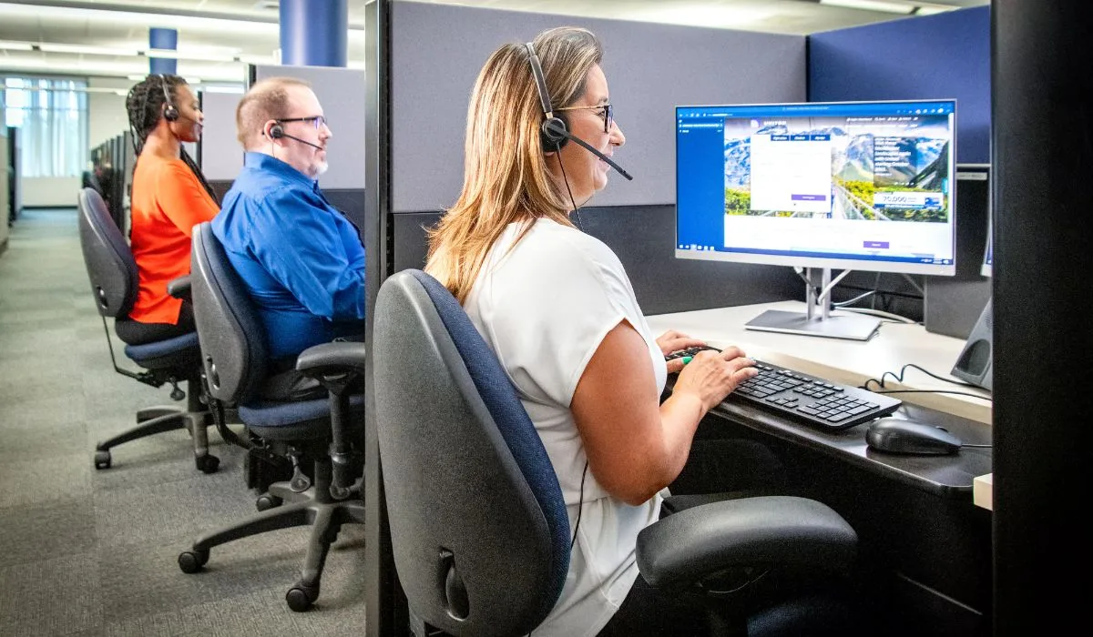 United Airlines reservation agents working at computer terminals in a customer service centre